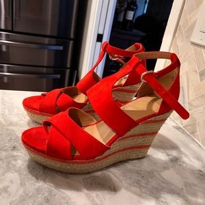 Brand new Nine West red wedges with gold stitching. Never worn.